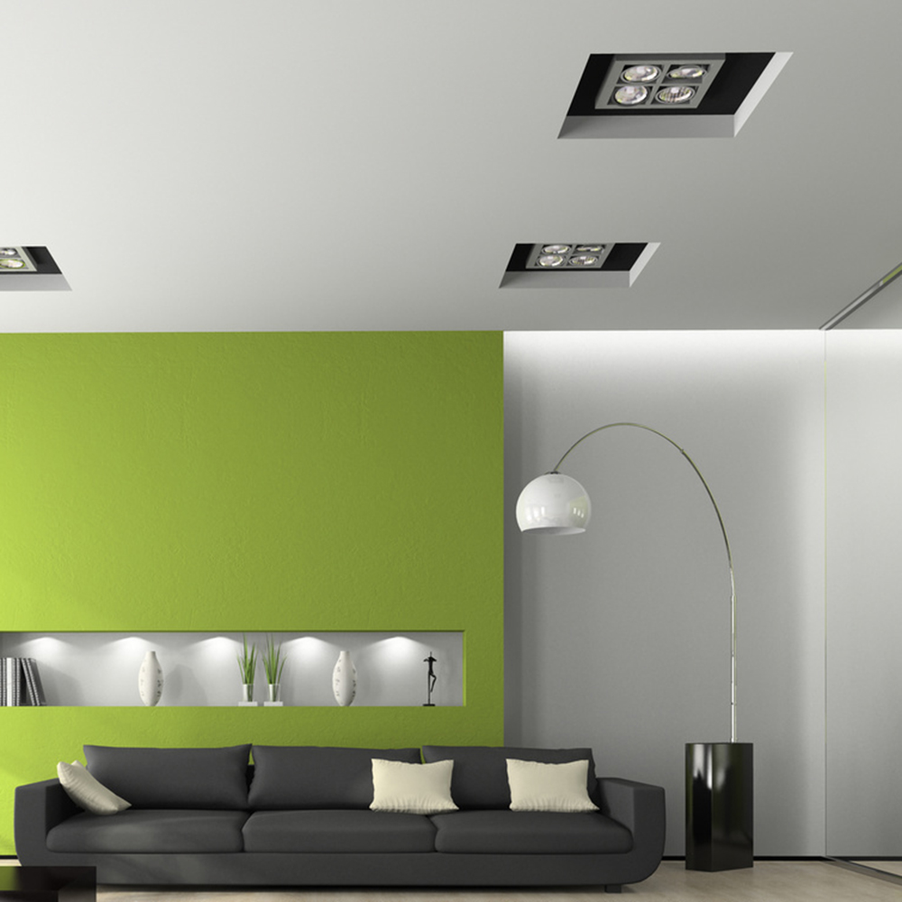 Modernes Wohnzimmer mit grüner Akzentwand und indirekter Beleuchtung